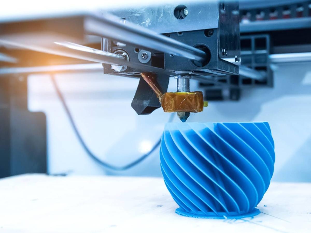 A futuristic 3D printing machine creating a complex prototype in a laboratory